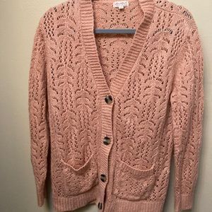 Pink sweater button